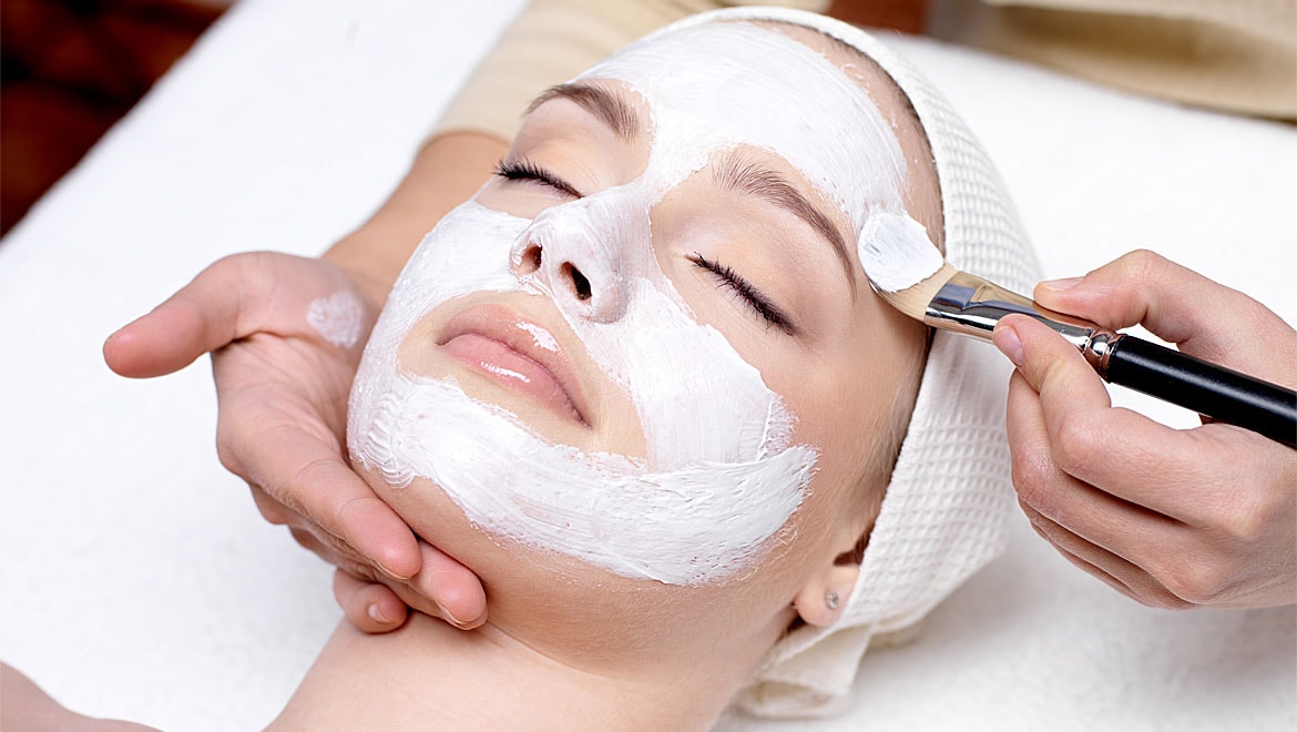 Professional facial treatment with skincare mask application